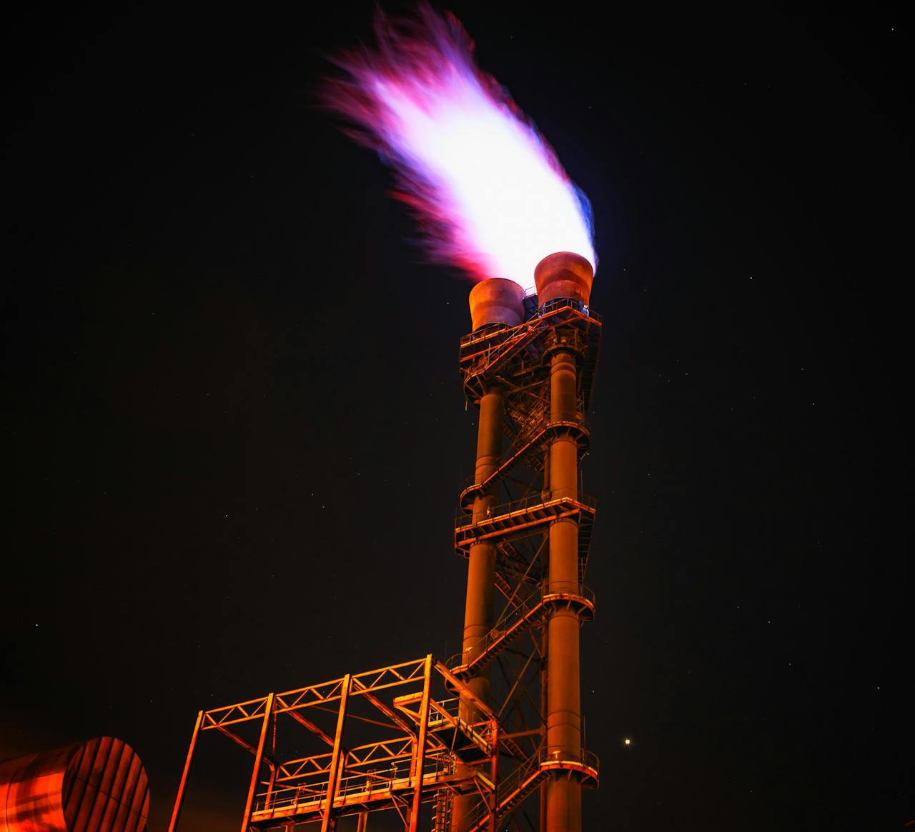 The Art of Drawing Readers In: Your attractive post title goes here Dramatic night photo of gas flare on industrial facility emitting a powerful flame.